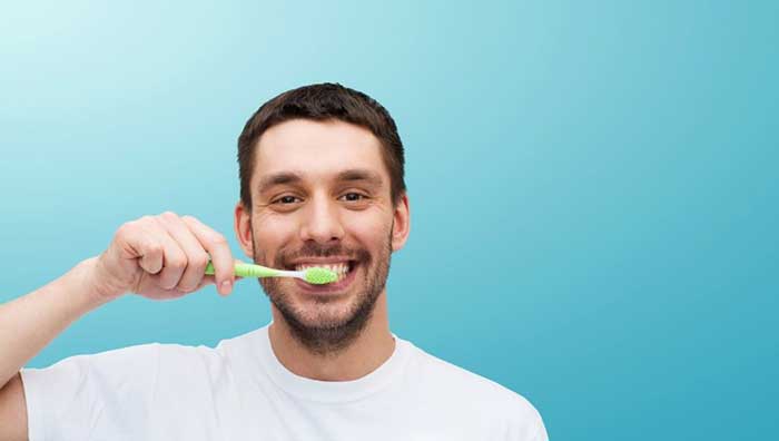 A boy brushing his teeth