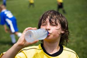 Small boy drinking water