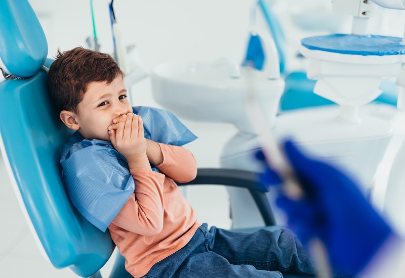 A young boy at the dental clinic, showcasing children's dental anxiety in Germantown, TN