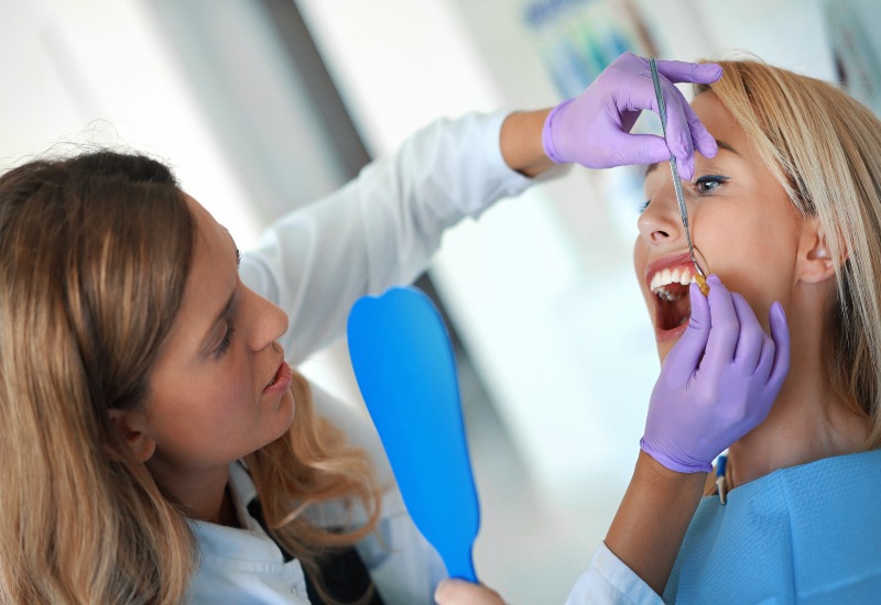 A dentist performing enamel shaping, transforming smiles with expert dental care in Germantown, TN